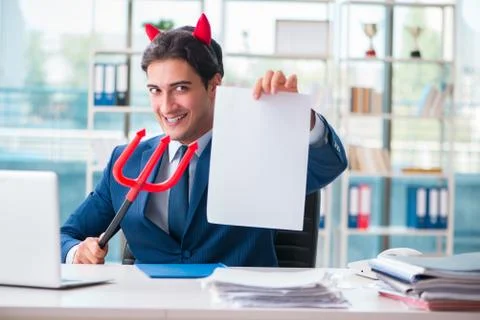 Devil angry businessman in the office Stock Photos