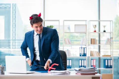 Devil angry businessman in the office Stock Photos