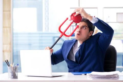 Devil angry businessman in the office Stock Photos