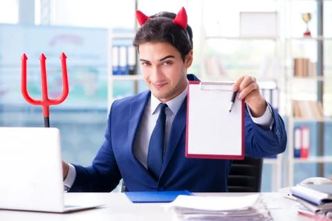 Devil angry businessman in the office Stock Photos