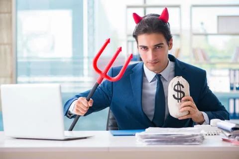 Devil angry businessman in the office Stock Photos