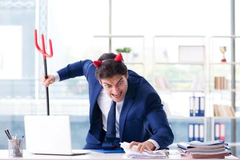 Devil angry businessman in the office Stock Photos