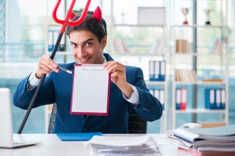 Devil angry businessman in the office Stock Photos