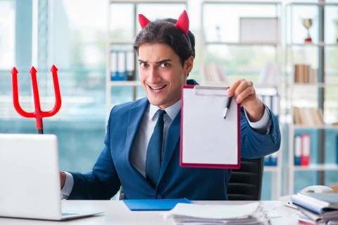 Devil angry businessman in the office Stock Photos