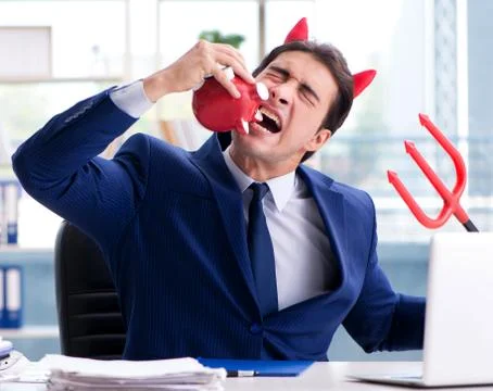 Devil angry businessman in the office Stock Photos