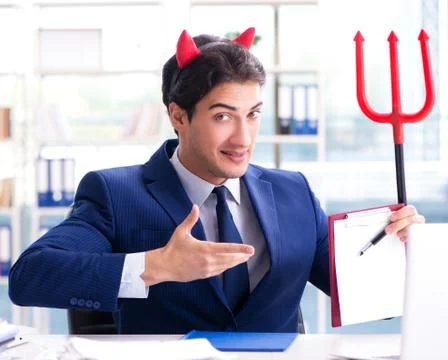 Devil angry businessman in the office Stock Photos