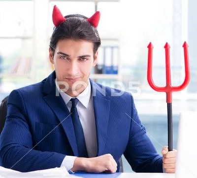 Devil angry businessman in the office Stock Photos