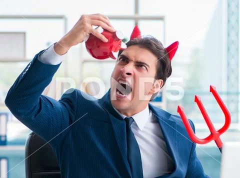 Devil angry businessman in the office Stock Photos