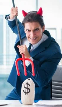 Devil angry businessman in the office Stock Photos