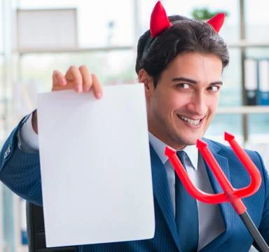 Devil angry businessman in the office Stock Photos