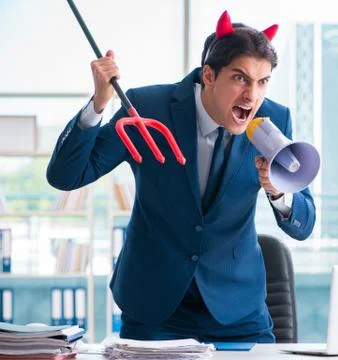 Devil angry businessman in the office Stock Photos