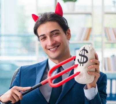 Devil angry businessman in the office Stock Photos