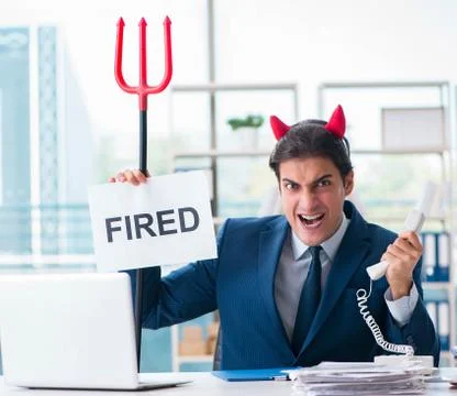 Devil angry businessman in the office Stock Photos
