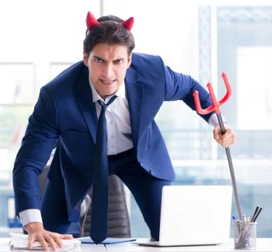 Devil angry businessman in the office Stock Photos