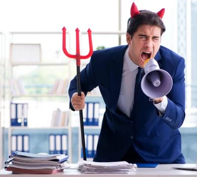 Devil angry businessman in the office Stock Photos