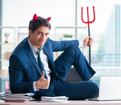 Devil angry businessman in the office Stock Photos