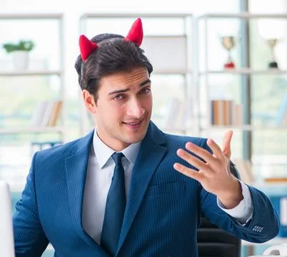 Devil angry businessman in the office Stock Photos