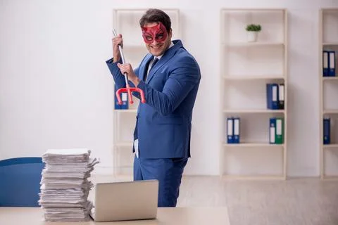 Devil businessman and too much work in the office Stock Photos