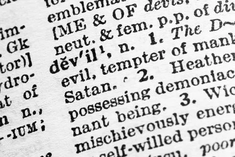 Devil - Closeup macro of English dictionary page with word devil concept Stock Photos