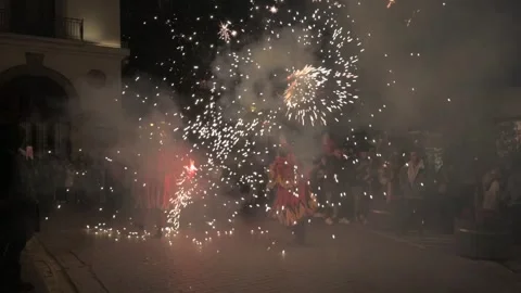 Devil dancers with fire in a Correfocs performance in Valencia, Spain Stock Footage 299967776