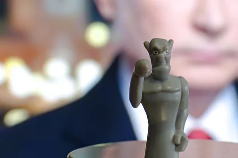Devil figurine on blurred cinema screen background Stock Photos