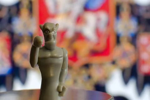 Devil figurine on blurred cinema screen background Stock Photos