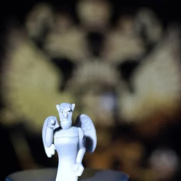 Devil figurine on blurred cinema screen background Foto stock