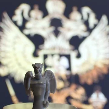 Devil figurine with wings on blurred background Stock Photos