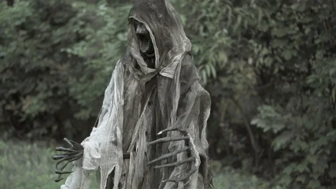 The devil in the form of a skeleton is dancing in the forest, celebrating his Stock Footage 100043107