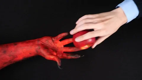 Devil gives a paradise apple to a man. Video stock 80417145