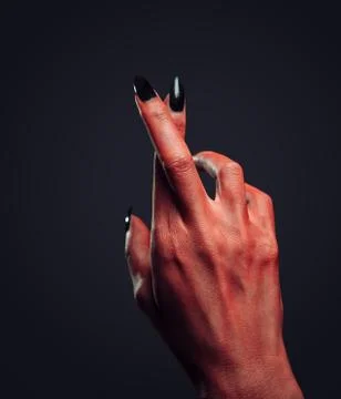 Devil hand with gesture cross fingers Stock Photos