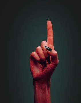 Devil hand with gesture pointing upward Stock Photos