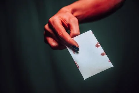 Devil hand gives empty card Stock Photos