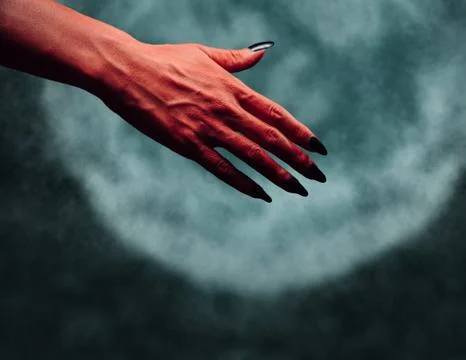Devil hand with handshake gesture at midnight Stock Photos