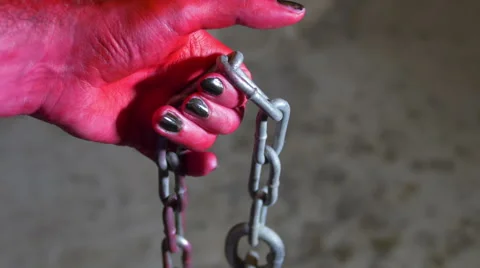 Devil hand with hook chain satan hell Stock Footage 63928429