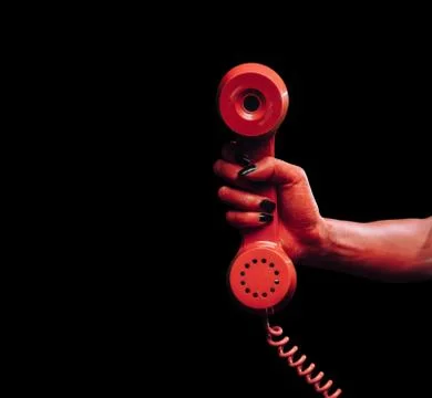 Devil hand with phone handset Stock Photos