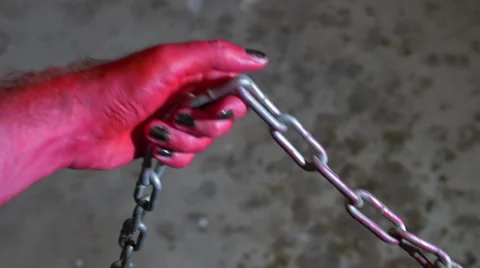 Devil hand pulling chain Stock Footage 63928243