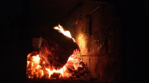 Devil Head Firewood Burns Out with Flame of fire &amp; Coals Smolder in Dark Stove 2 Stock Footage 167971156