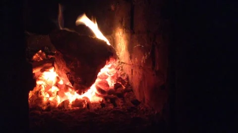 Devil Head Firewood Burns Out with Flame of fire &amp; Coals Smolder in Dark Stove 4 Stock Footage 167971167