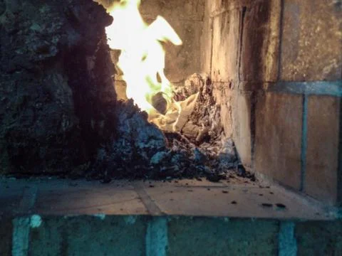 The devil hiding in the flames Foto stock