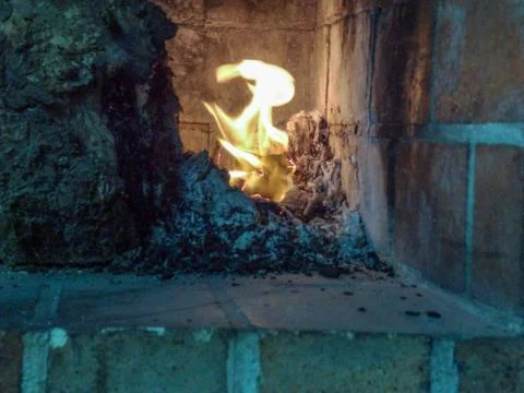 The devil hiding in the flames Stock Photos