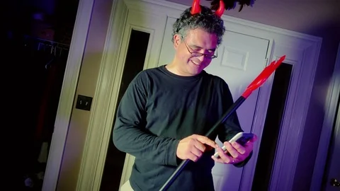 Devil man on a phone Stock Footage 95525556