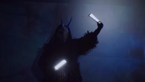 The devil monster dances. A mystical man in a scary mask in a dark studio. Stock Footage 266566568