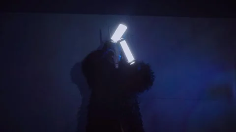 The devil monster dances. A mystical man in a scary mask in a dark studio. Stock Footage 266566586