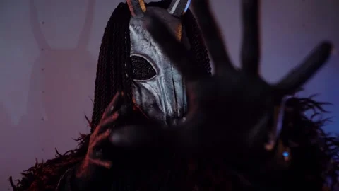 The devil monster dances. A mystical man in a scary mask in a dark studio. Stock Footage 268480763