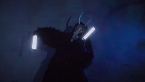 The devil monster dances with RGB sticks in his hands. A man in a scary mask Stock Footage 266919973