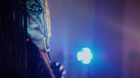 The devil monster plays the flute. A mystical man in a scary mask Stock Footage 268481148