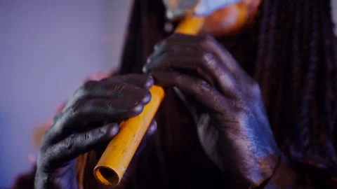 The devil monster plays the flute. A mystical man in a scary mask Stock Footage 268481198