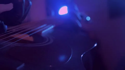 The devil monster plays the guitar. A mystical man in a mask in a dark studio Stock Footage 250530595
