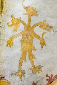 Devil with multiple heads, medieval fresco Foto stock